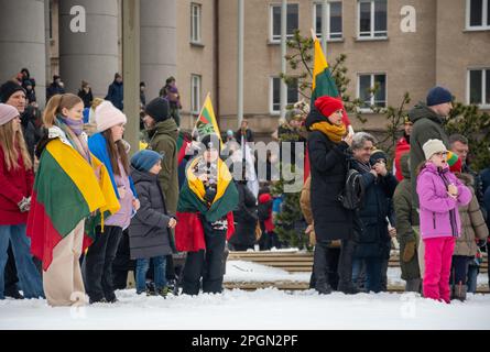 Vilnius  Lithuania - March 11 2023: Children with Lithuanian and Ukrainian flags during a ceremony Stock Photo