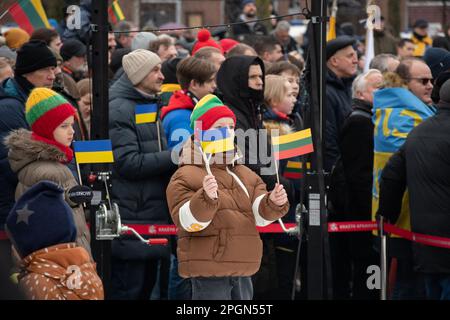 Vilnius  Lithuania - March 11 2023: Children with Lithuanian and Ukrainian flags during a ceremony Stock Photo