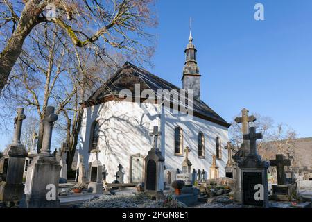 Europe, Luxembourg, Diekirch, Esch-sur-Sure, Chapel Ste-Croix with Trees and Graves in the Wintertime Stock Photo