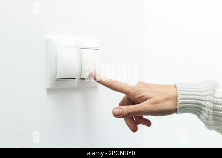 Activating Power: Woman Pressing Energy Switch Stock Photo