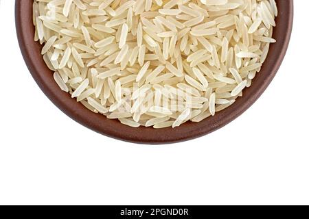 Healthy basmati rice in a clay ceramic bowl close-up isolated on white background Stock Photo