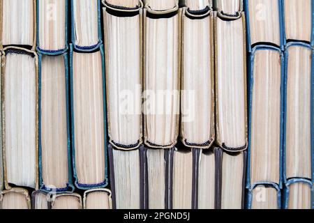 Background from the edges of old shabby books. High quality design background Stock Photo