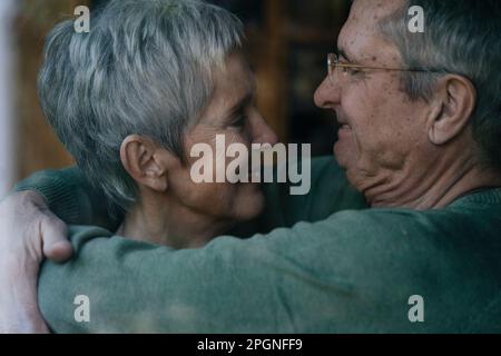 Affectionate senior couple hugging Stock Photo