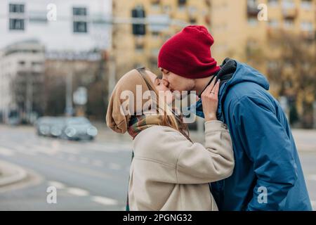 Romantic couple kissing each other at street Stock Photo