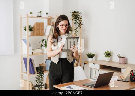 Businesswoman using tablet PC in office Stock Photo
