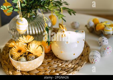 Easter eggs and decoration on table at home Stock Photo