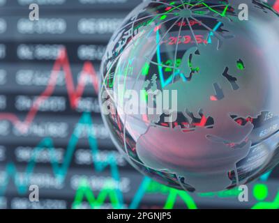 Glass globe with graphs and data in background Stock Photo