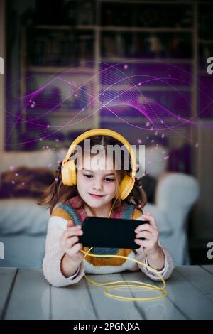 Smiling girl wearing headphones using smart phone at home Stock Photo