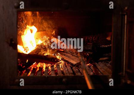 Firewood burning in barbecue grill Stock Photo