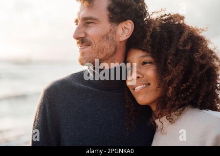 Loving couple spending time together at beach Stock Photo