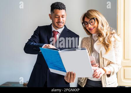 Business partners working on documents in office Stock Photo
