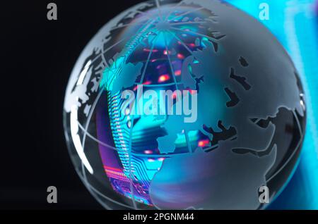 Circuit board reflecting in shiny globe Stock Photo