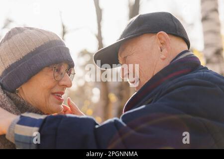 Romantic senior couple face to face at park Stock Photo