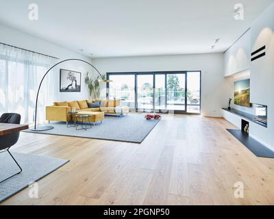 Empty living room with hardwood floor in modern apartment Stock Photo