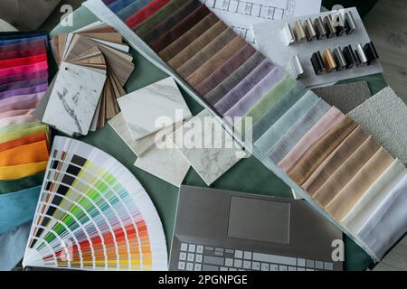 Desk with multi colored fabric samples arranged at office Stock Photo