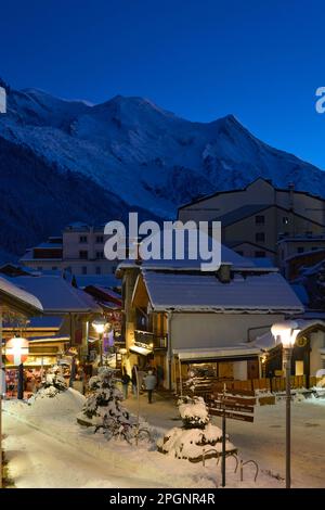 Houses in front of mountains at night Stock Photo