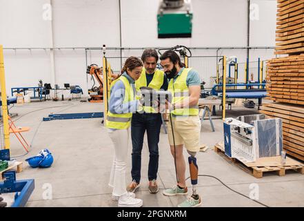 Engineers working with control panel in factory Stock Photo
