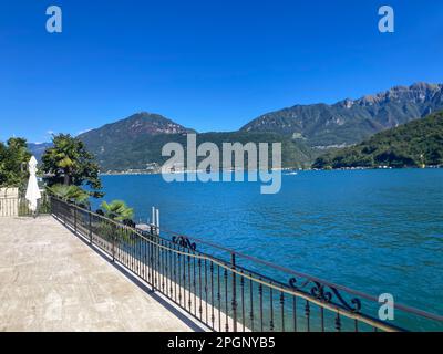 View on Lake Lugano with Mountain in a Sunny Summer Day in Morcote, Ticino, Switzerland. Stock Photo