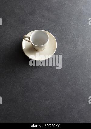 Empty coffee cup against black background Stock Photo