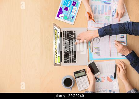 Team of web designers working in office, top view Stock Photo