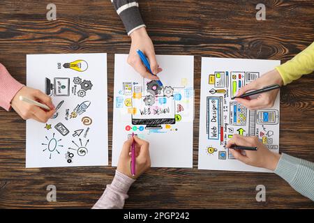 Team of web designers working in office, top view Stock Photo