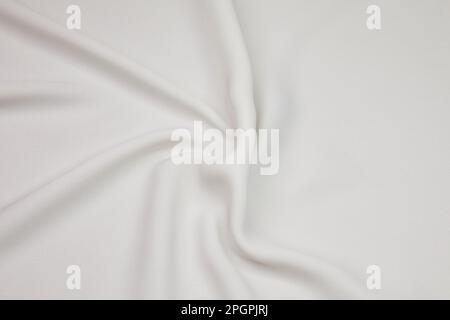 White fabric background. White cloth waves background texture. White fabric cloth textile material. Stock Photo