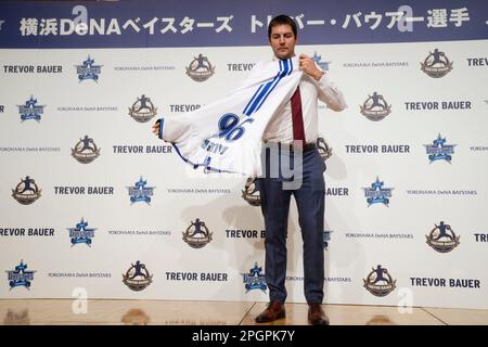 Trevor Bauer puts on his new uniform of Yokohama DeNA BayStars during a  photo session of the news conference Friday, March 24, 2023, in Yokohama,  near Tokyo. (AP Photo/Eugene Hoshiko Stock Photo 