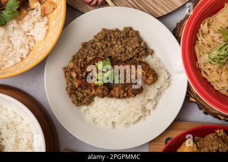Fried Fish egg cupwith lentils Peruvian food buffet table Assorted dishes gourmet cuisine Peru traditional Stock Photo