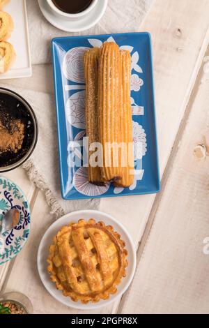 Churros Peruvian desserts buffet table brunch sweet food Stock Photo