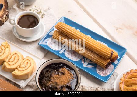 Churros Peruvian desserts buffet table brunch sweet food Stock Photo