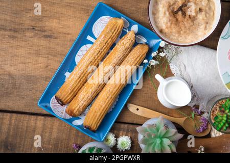 Churros Peruvian desserts buffet table brunch sweet food Stock Photo