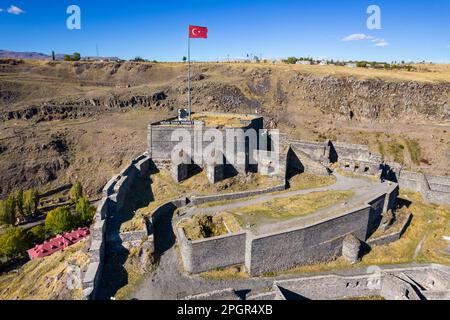 Kars, Turkey - October 25, 2022: Castle of Kars (Turkish: Kars Kalesi) view with blue sky. Castle is a former fortification located in Kars, Turkey. B Stock Photo