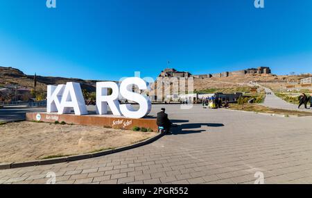 Kars, Turkey - October 25, 2022: Castle of Kars (Turkish: Kars Kalesi) view with blue sky. Castle is a former fortification located in Kars, Turkey. Stock Photo