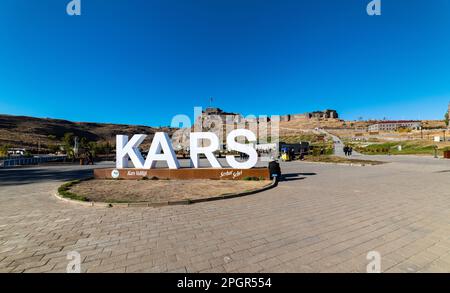 Kars, Turkey - October 25, 2022: Castle of Kars (Turkish: Kars Kalesi) view with blue sky. Castle is a former fortification located in Kars, Turkey. Stock Photo