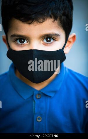 Little boy wearing face mask Stock Photo