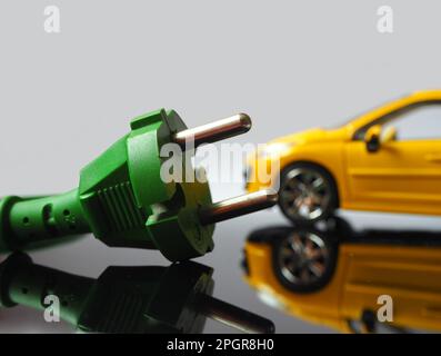 Renewable generation concept. Cars on batteries powered by green energy. Electric vehicle charging network. Stock Photo