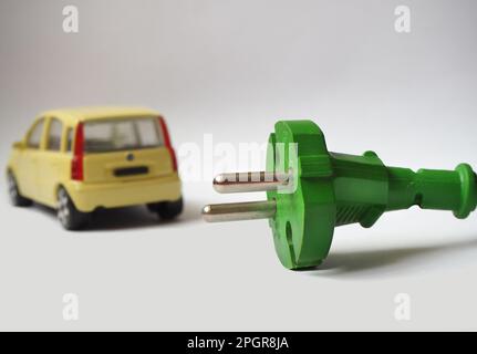 Green power for electric vehicles. Sustainable energy concept Stock Photo