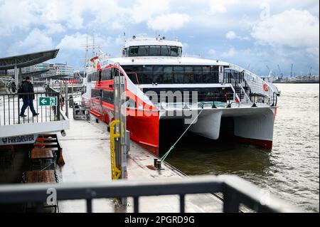 Hamburg, Germany. 24th Mar, 2023. The Helgoland catamaran before departure at the Landungsbrücken. The winter break is over: The Helgoland catamaran 'Halunder Jet' started the new season on Friday. Until October 31, it will sail daily from Hamburg and Cuxhaven to the North Sea island of Helgoland. Credit: Jonas Walzberg/dpa/Alamy Live News Stock Photo