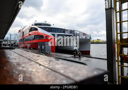 Hamburg, Germany. 24th Mar, 2023. The Helgoland catamaran before departure at the Landungsbrücken. The winter break is over: The Helgoland catamaran 'Halunder Jet' started the new season on Friday. Until October 31, it will sail daily from Hamburg and Cuxhaven to the North Sea island of Helgoland. Credit: Jonas Walzberg/dpa/Alamy Live News Stock Photo