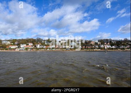 Hamburg, Germany. 24th Mar, 2023. Clouds pass in front of a blue sky over the Elbe slope at the Övelgönner Elbstrand. Credit: Jonas Walzberg/dpa/Alamy Live News Stock Photo