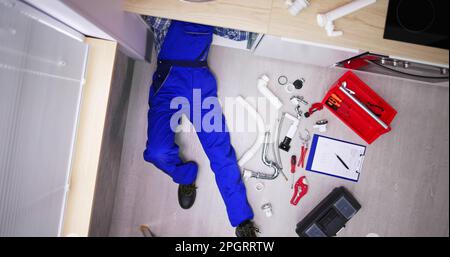 Plumber Cleaning Pipe. Unclog Drain And Sink Stock Photo