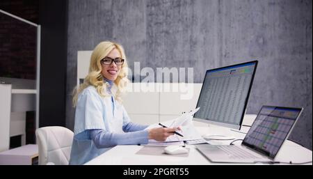Account Manager In Office Coding Medical Bill Stock Photo