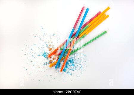 Colorful kids candy sherbet filled straws on white Stock Photo