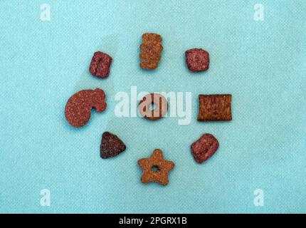 dried cat food in different shapes Stock Photo