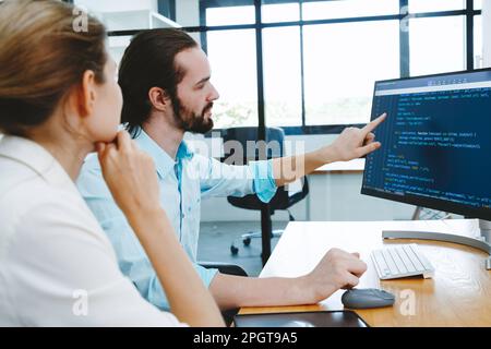 Professional development programers programming game software or developing code for shopping online financial data security system network working at Stock Photo