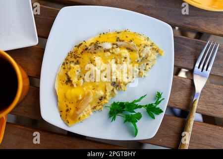 National French dish, omelet made from lightly beaten eggs with milk and herbs Stock Photo