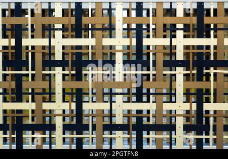 Closeup of a colorful abstract metal fence pattern Stock Photo