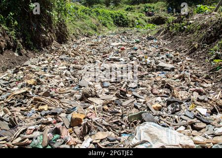 Nakuru, Kenya. 23rd Mar, 2023. View of a dry river bed littered with piles of trash, mostly plastic at Njoro River. Despite increased voluntary initiatives and national regulations to curb pollution, the problem of plastic waste ending up in the natural environment is not reducing. Credit: SOPA Images Limited/Alamy Live News Stock Photo