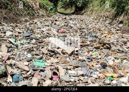 Nakuru, Kenya. 23rd Mar, 2023. View of a dry river bed littered with piles of trash, mostly plastic at Njoro River. Despite increased voluntary initiatives and national regulations to curb pollution, the problem of plastic waste ending up in the natural environment is not reducing. Credit: SOPA Images Limited/Alamy Live News Stock Photo