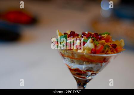 A fruit cocktail dessert topped with pomegranate seeds Stock Photo